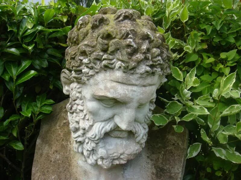 A large vintage reconstitutred stone bust of Hercules on a plinth - 4149