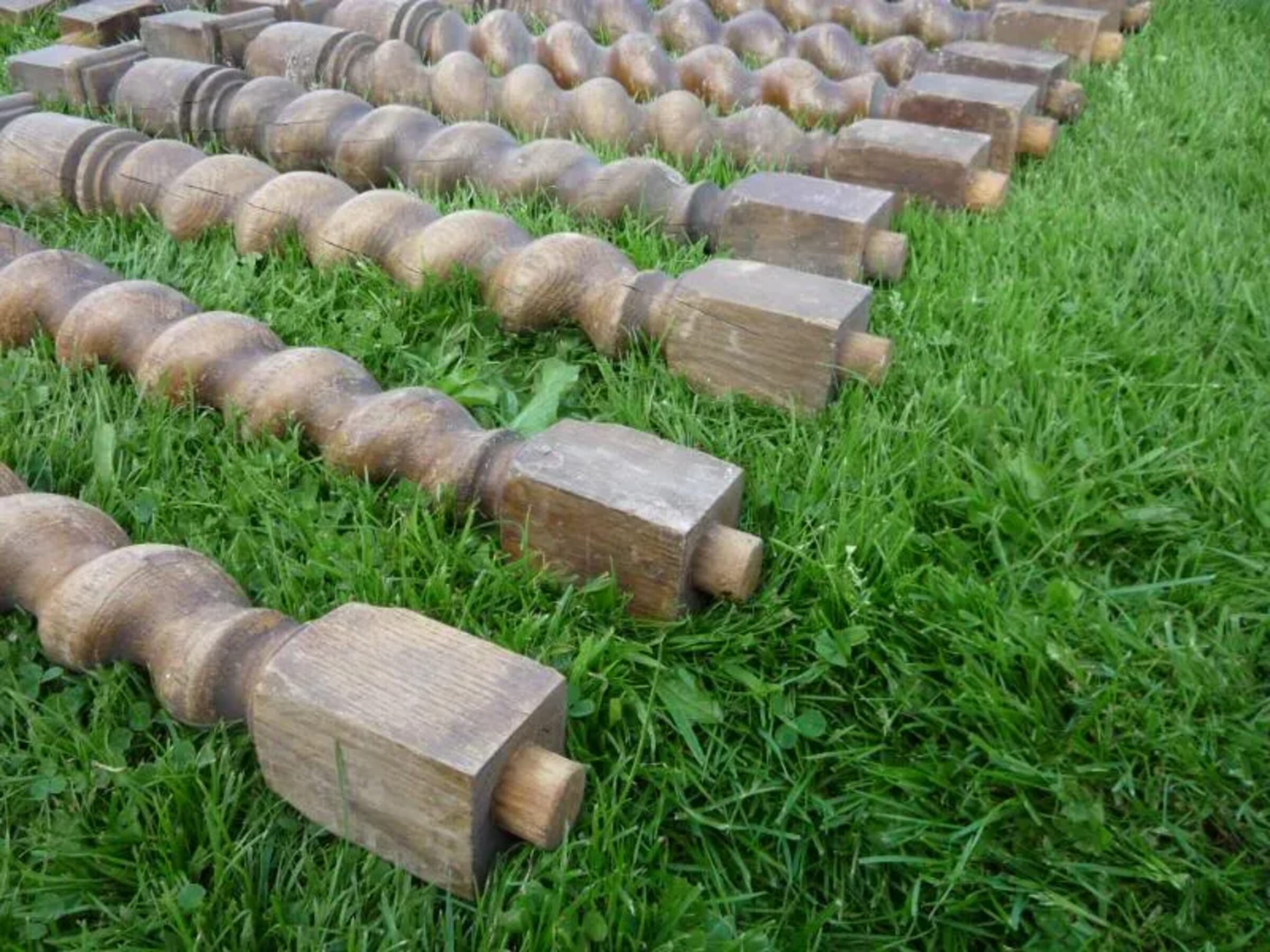 A set of 18 antique oak barley twist table legs