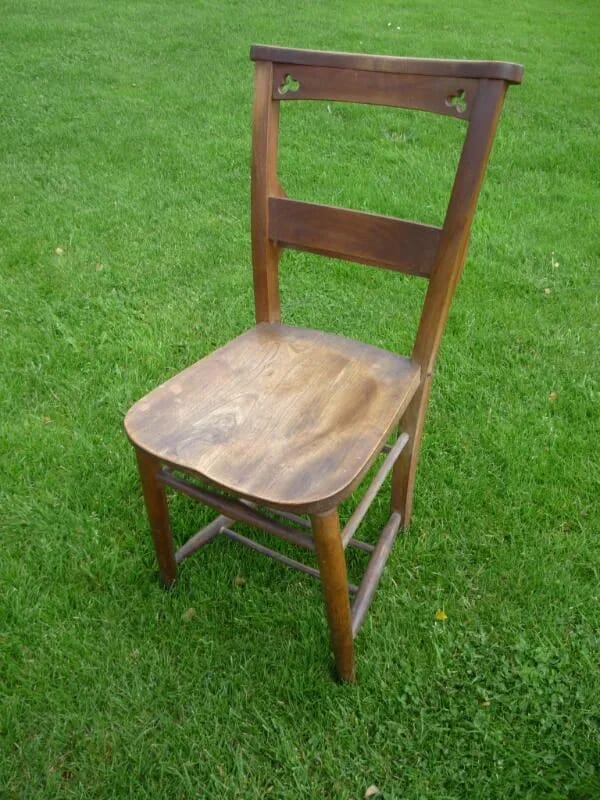 Antique church chairs with trifoils in the rear - 4154