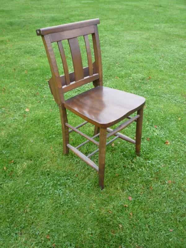 Dark coloured antique church chairs