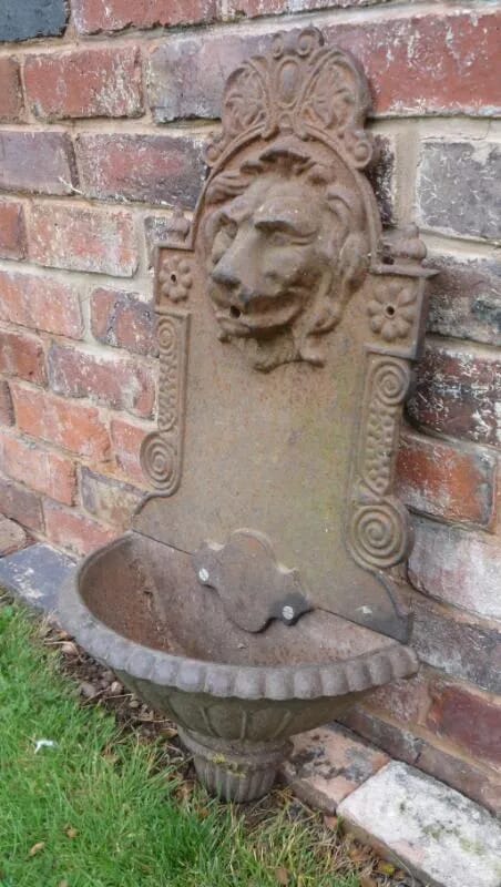 A Victorian cast iron wall mounted Lion water fountain - 4235