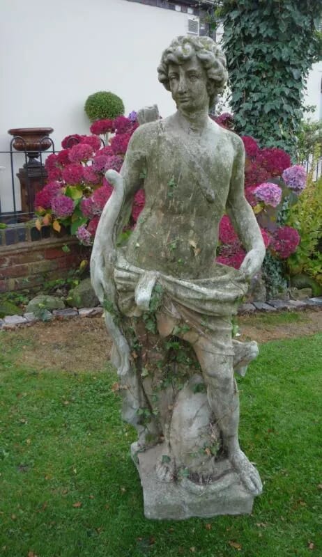 A large vintage reconstitutred stone male hunter figure - 4348