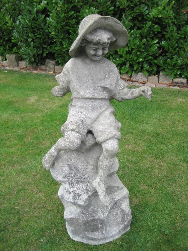 Vintage Garden Statue of a young child playing on a rock - 4956