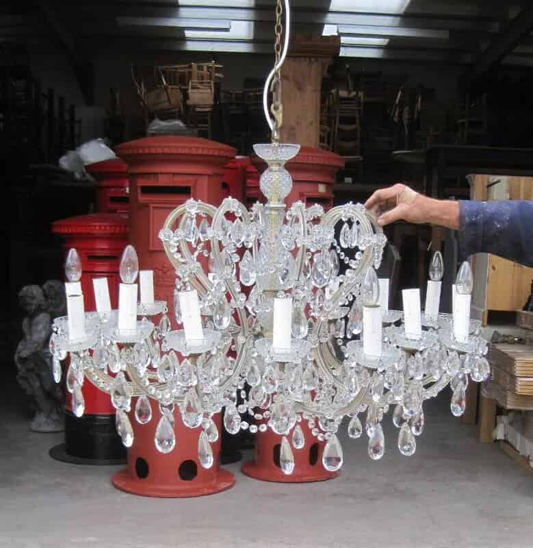 A Venetian moulded and cut glass sixteen light chandelier