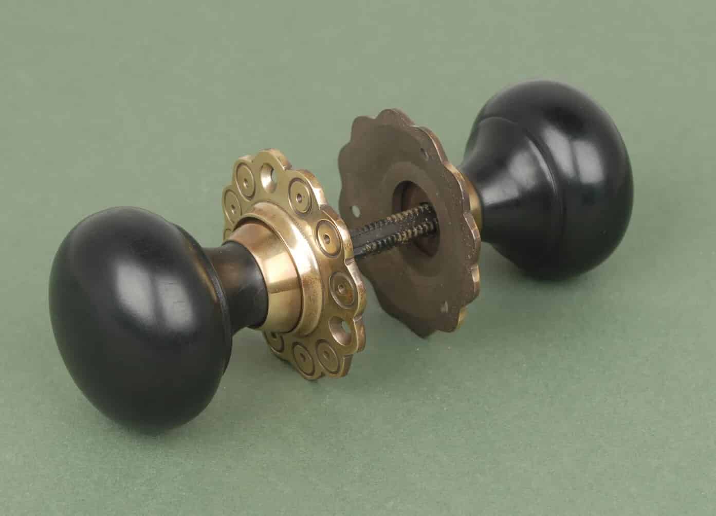 Solid Ebony Bun Knobs with Aged Brass Roseplate