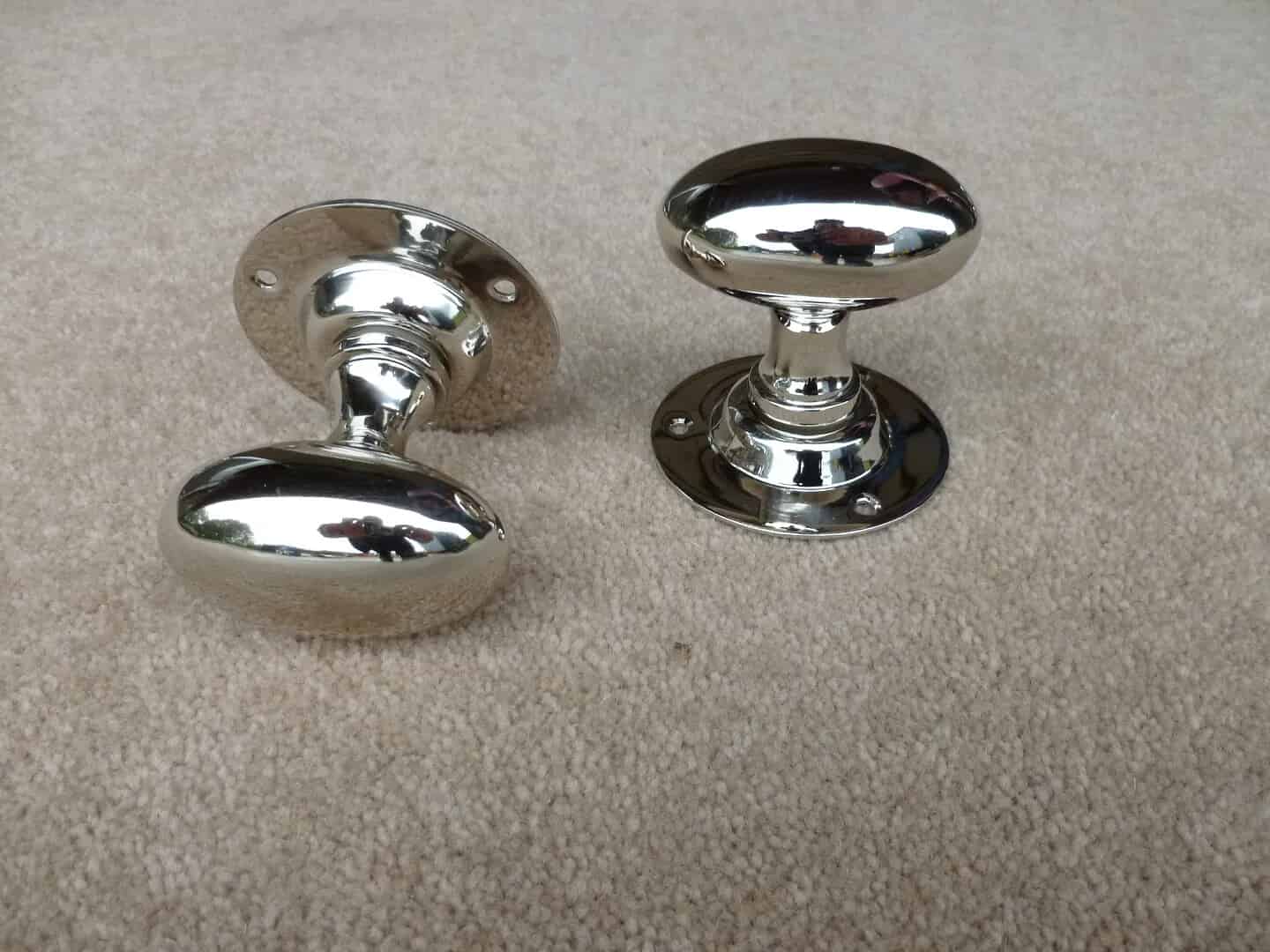 This is a Pair Of Oval Nickel Door Knobs