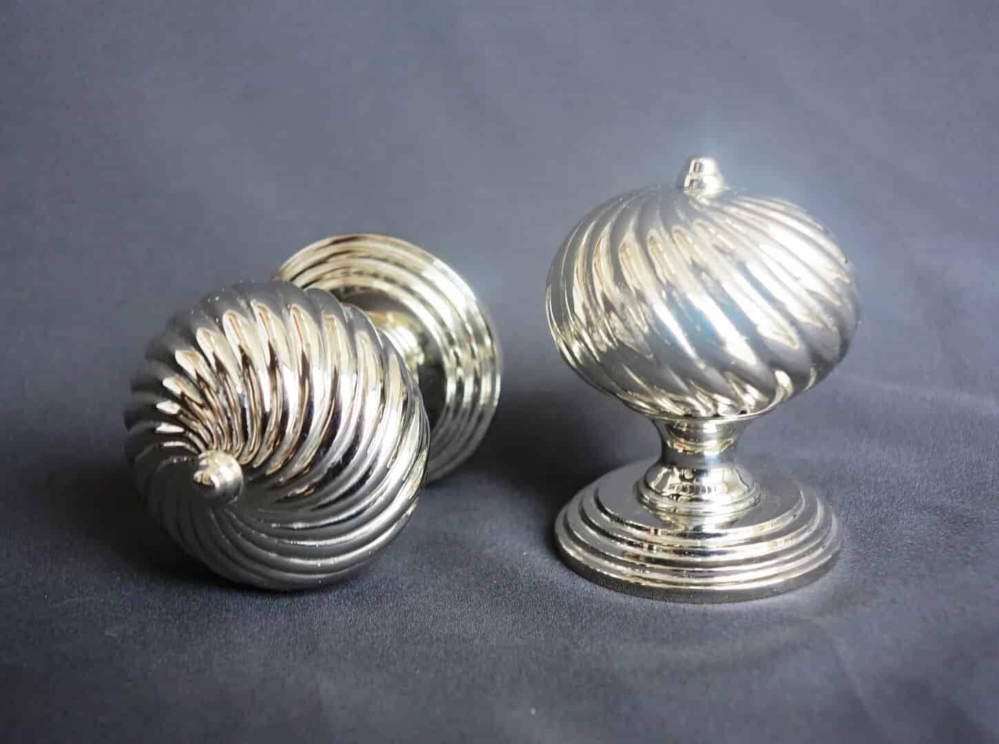 This is a Pair of Twisted Burcot Nickel Door Knobs